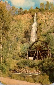 Colorado Idaho Springs Waterfall and Old Time Waterwheel In Clear Creek