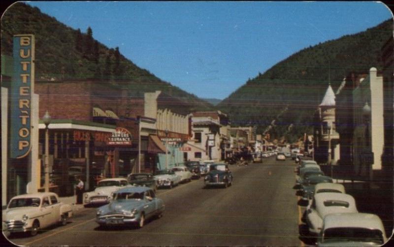 Coeur D'Alene Bank St. c1950 Old Cars & Store Signs Postcard