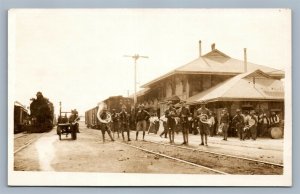 WWI US ARMY MUSICIANS at RAILROAD STATION ANTIQUE REAL PHOTO POSTCARD RPPC train