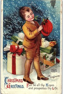 C.1910 Clapsaddle Cute Boy Christmas Presents Snow Postcard P134