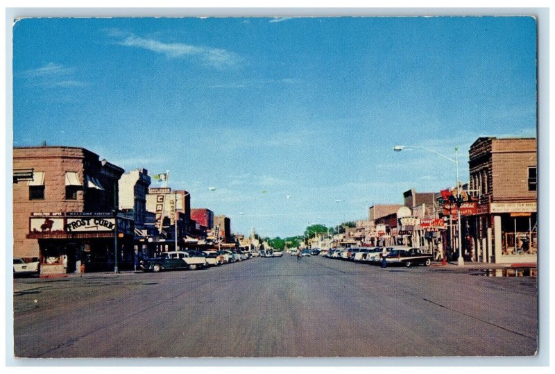 Main Street View Car-lined Stores Cafe Shops Cody Wyoming WY Vintage Postcard