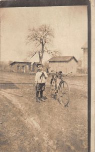 J31/ Interesting RPPC Postcard c1910 Young Boy Bicycle Rifle Gun 198