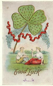 Vintage Postcard 1909 Good Luck Greetings Boy and Girl In Field Shamrock Leaves