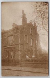 RPPC Beautiful Large Brick Home Two Older Women Thannone & Carson Postcard B23