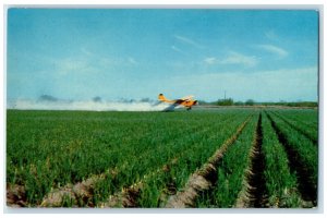c1950's DB-509 Yellow Airplane For Insecticides Fertilizers Laredo TX Postcard