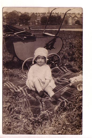 Real Photo, Baby on Blanket in Front of Carriage