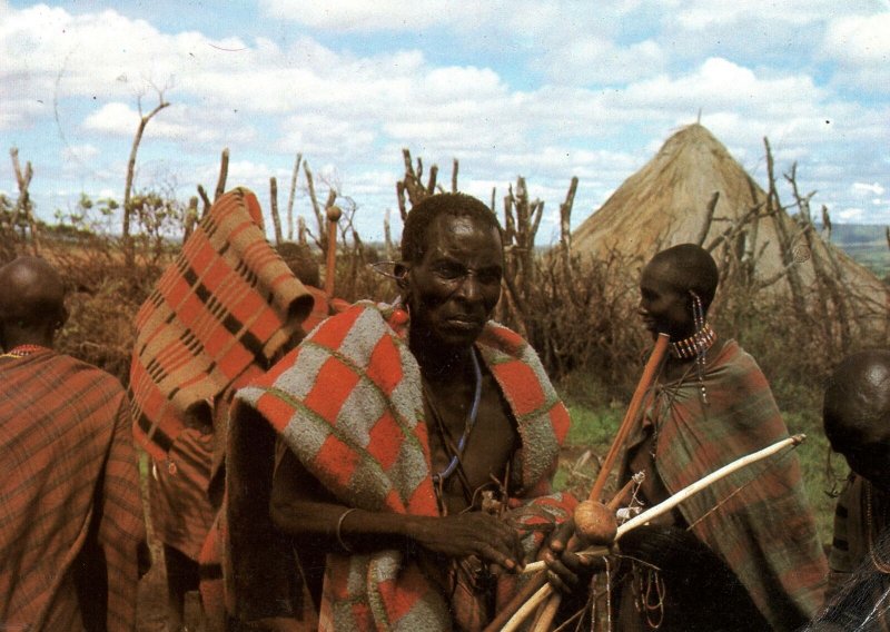 VINTAGE CONTINENTAL SIZE POSTCARD MASAI FAMILY MAILED FROM TANZANIA