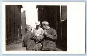 La Crosse WI Postcard RPPC Photo Occupational Workers Fighting Boxing Candid # 1