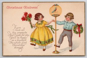 Christmas Girl Yellow Dress Children Dancing around Bird Cage Postcard U26