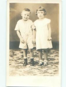 rppc 1920's GIRL AND BOY STANDING TOGETHER AC7880