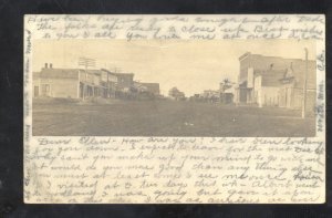 RPPC OAKLEY KANSAS DOWNTOWN DIRT STREET SCENE JENNINGS KS REAL PHOTO POSTCARD