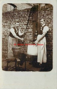 Unknown Location, RPPC, Two Men Smoking Pipes while Working