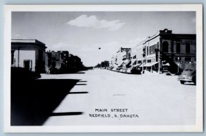 Redfield SD Postcard RPPC Photo Main Street Hardware State Drugs Store Cars