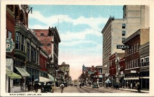 Postcard MO Joplin Main Street View Streetcar Saloon Dentist Shops 1920s V56