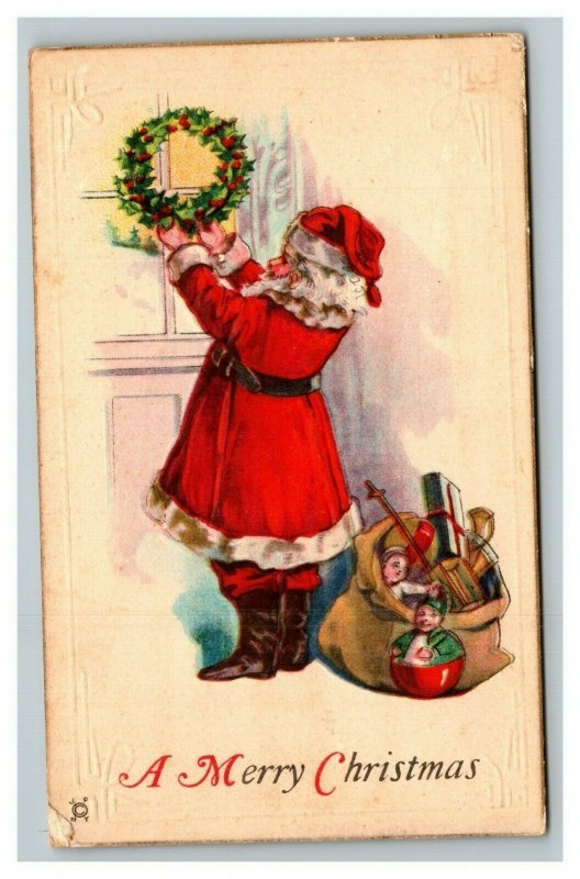 Vintage 1922 Christmas Postcard - Santa Hanging Wreath Bag Full of Toys NICE