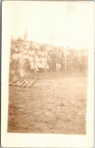 RPPC Crowd of people behind chicken wire fence Man with bullhorn 1904-1918