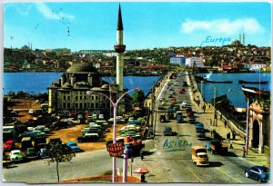 VINTAGE CONTINENTAL SIZE POSTCARD THE ATATURK BRIDGE SEPARATING EUROPE & ASIA