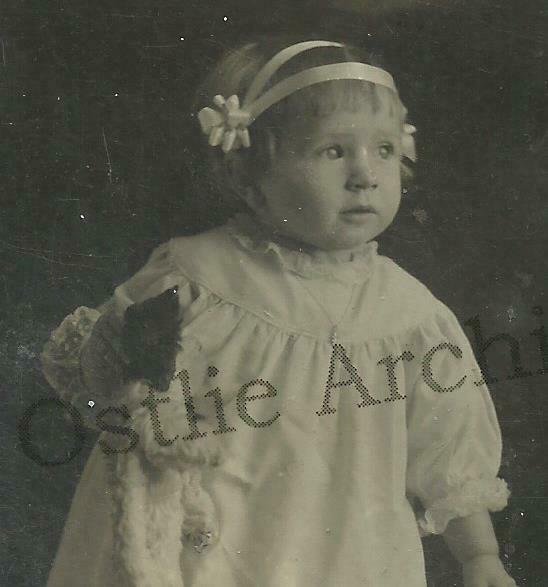 RPPC c1910 LITTLE GIRL Holding TEDDY BEAR Posing CHAIR Studio Shot PARTY DRESS