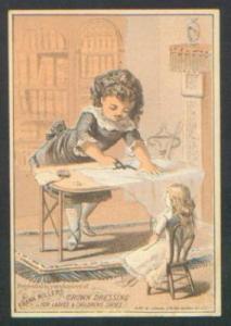 D149  Trade Card child with Doll making doll Clothes