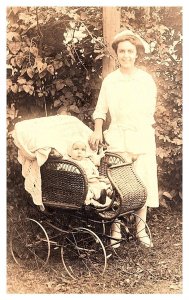 Nanny Nurse, Baby in wicker stroller