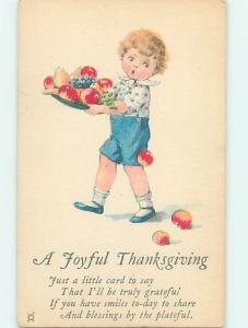 Pre-Linen thanksgiving FRUIT FALLS FROM OVERLOADED TRAY CARRIED BY BOY HQ7728@