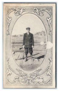 RPPC YOUNG MAN Posing with RIFLE Fancy Border c1910s Hunting related Postcard