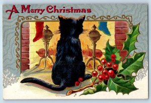 c1910's Christmas Black Cat Fireplace Holly Berries Embossed Nash Postcard
