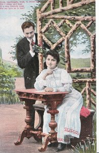 Romance Postcard - Young Man Stood and Young Lady Sat at Table Writing  XX675