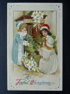 A JOYFUL CHRISTMAS Children Making a Christmas Wreath c1914 Embossed Postcard