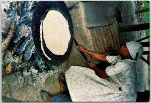 VINTAGE CONTINENTAL SIZED POSTCARD BELIZEAN GARIFUNA WOMAN BAKING CASSAVA 1982