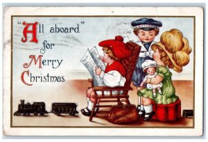 1915 Christmas Train Passenger All Aboard Muscatine Iowa IA Embossed Postcard 