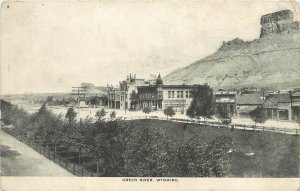 UDB Postcard; Green River WY Main Street Scene Hardware Butcher Bakery Signs