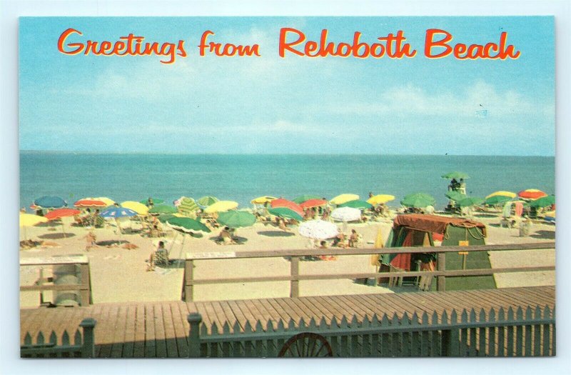 Postcard DE Rehoboth Beach Greetings View of Beach Boardwalk Umbrellas J16