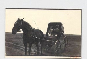 RPPC REAL PHOTO POSTCARD HORSE PULLING BUGGY WITH WOMAN AND GIRL GREAT HATS DRES