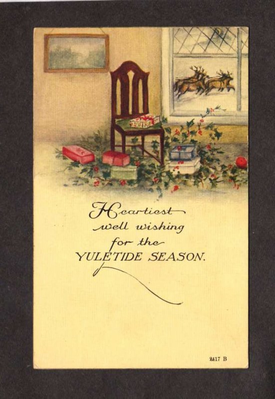 Christmas Yuletide Season Greetings Chair Window Gifts Reindeer Postcard