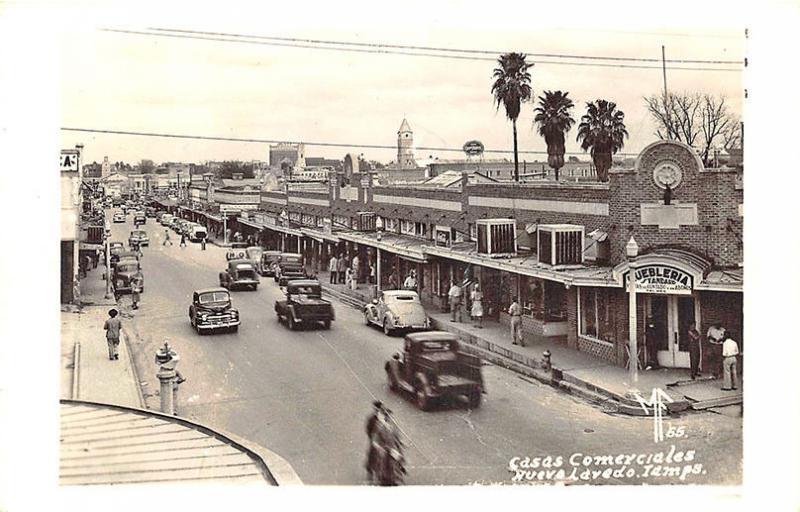 Nueva Laredo Mexico Street View Store Fronts Old Cars Trucks RPPC Postcard