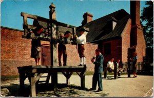Postcard VA Williamsburg Public Gaol putting people into stocks