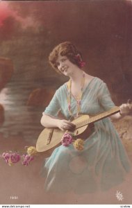 RP;  Woman wearing blue dress playing guitar, 1900-10s