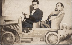 Portrait of Two Men in Toy Automobile Cigarettes The Red Devil RPPC Postcard H4