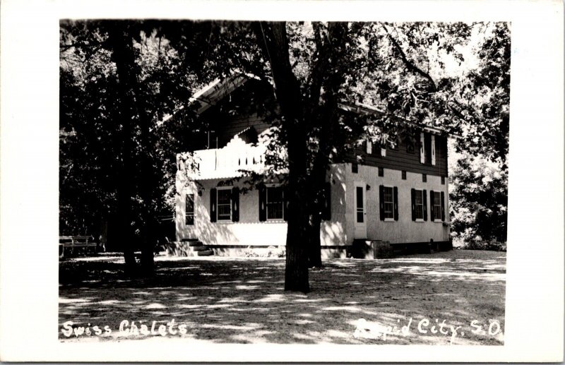 Real Photo Postcard Swiss Chalets at Rapid Canyon in Rapid City, South Dakota