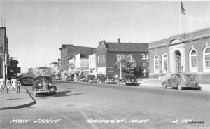 1940s Cheboygan Michigan Main Street Autos RPPC Real photo postcard 12877 Cook