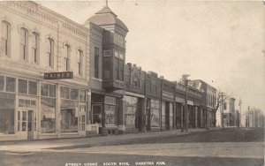 H43/ Sabetha Kansas RPPC Postcard c1910 Street haines Store South Side