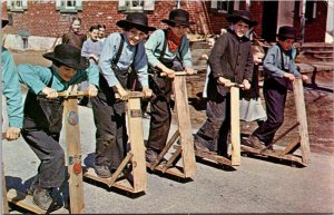 Pennsylvania Dutch Country Amish Boys With Their Homemade Scooters