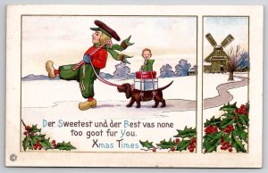 Christmas Dutch Boy With Dachshund Carrying Gifts Postcard U27