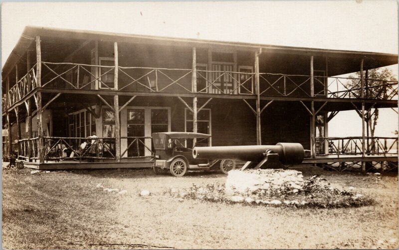 Building Cannon Automobile People on Veranda Unknown Location RPPC Postcard G65