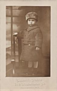 PROVIDENCE RI~YOUNG BOY IN HEAVY OVERCOAT & FUR HAT & SHORTS~REAL PHOTO POSTCARD