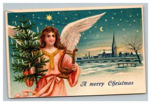 Vintage 1910's Christmas Postcard Angel with Gold Heart Xmas Tree Snow Village
