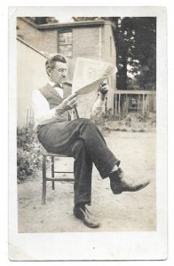 Gent Reading Newspaper in Backyard, unused Real Photo, AZO 4 Triangles 1904-1918