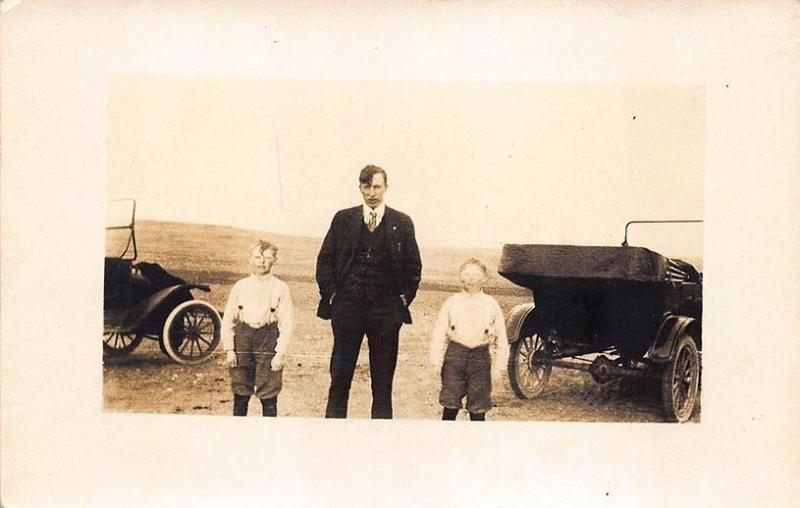 Tipton KS Two Old Cars Man Two Boys Real Photo RPPC Postcard