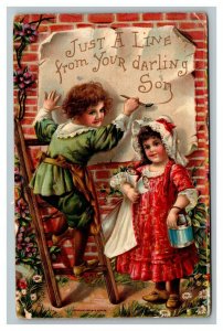 Vintage 1910's Postcard Cute Girl Holds Paint While Boy Paints Sign on Wall